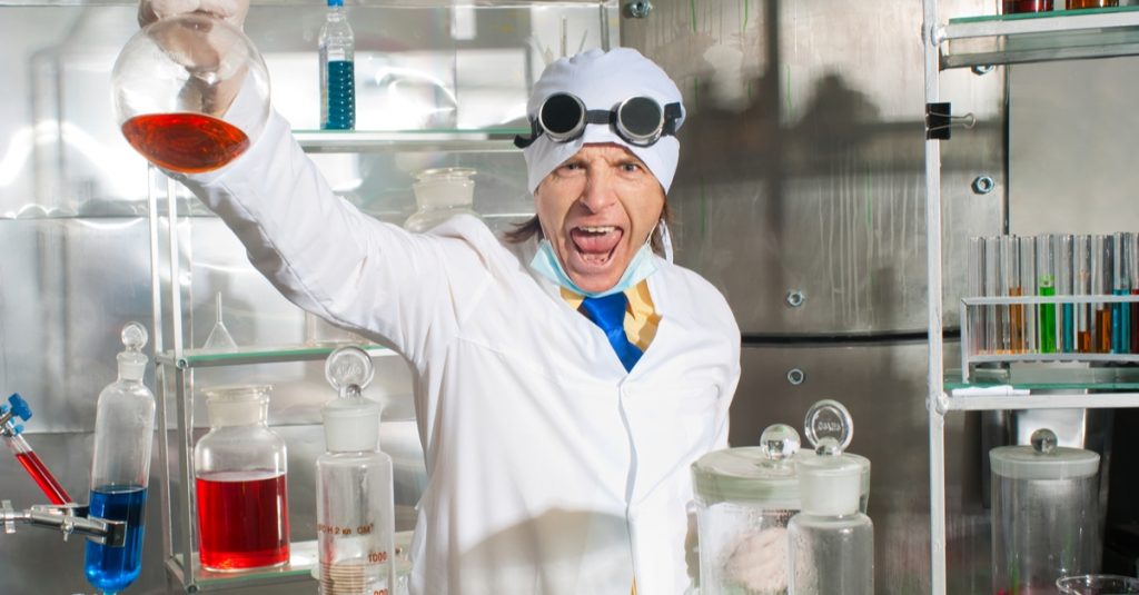 excultant emotional chemist in laboratory holding up flusk